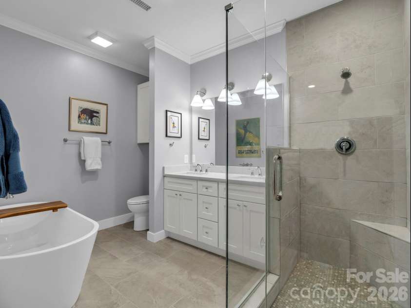 2255 Lake Adger Road, Mill Spring, NC 28756.  MLS# CAR4426062, YatesRealty ID 51693. Primary bathroom has a soaking tub and tile shower