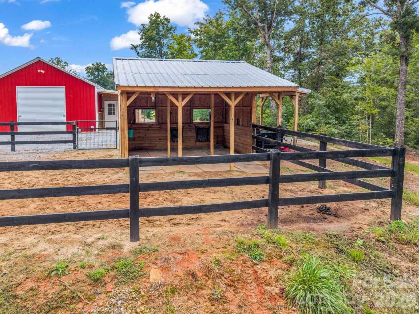 2255 Lake Adger Road, Mill Spring, NC 28756.  MLS# CAR4426062, YatesRealty ID 51693. Run-in shed with paddock