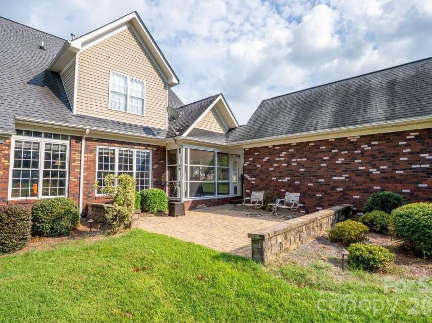 1927 Windmere Drive, Monroe, NC 28110.  MLS# CAR4418853, YatesRealty ID 51747. Backyard paver patio overlooks expansive and private back yard