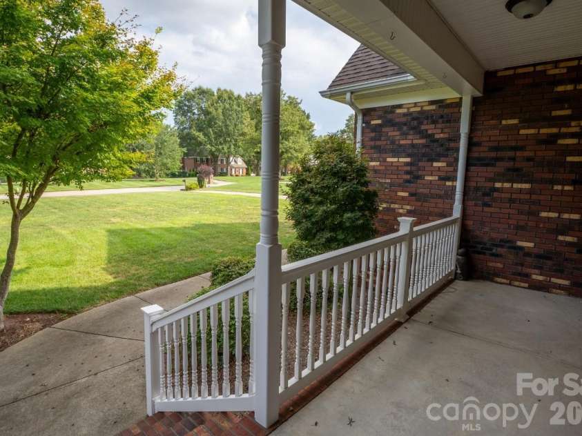 1927 Windmere Drive, Monroe, NC 28110.  MLS# CAR4418853, YatesRealty ID 51747. Front porch overlooks large front yard