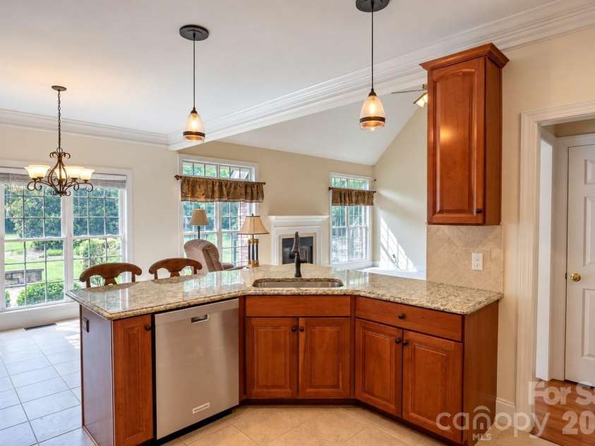 1927 Windmere Drive, Monroe, NC 28110.  MLS# CAR4418853, YatesRealty ID 51747. Kitchen adjoins casual dining area while overlooking the great room