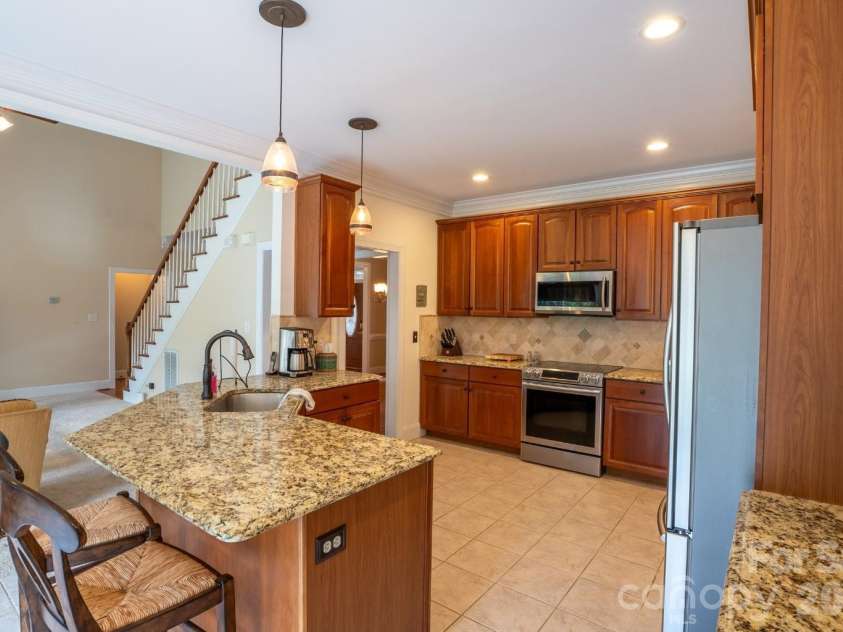 1927 Windmere Drive, Monroe, NC 28110.  MLS# CAR4418853, YatesRealty ID 51747. Kitchen includes Samsung stainless steel appliances and tile floors