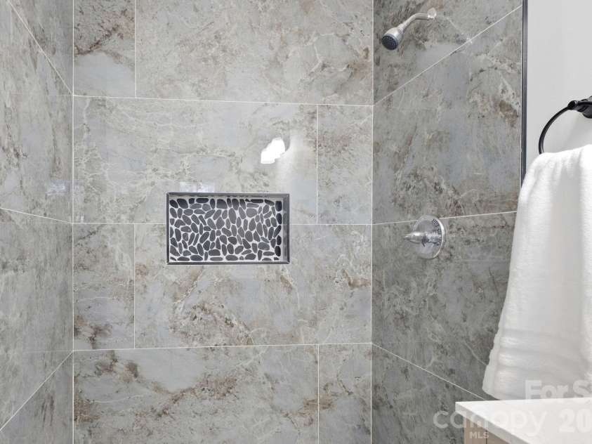 3231 Frazier Drive, Claremont, NC 28610.  MLS# CAR4426163, YatesRealty ID 51753. Tile shower in Primary Bath
