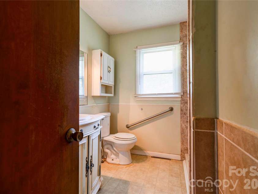 720 Levi Street, Shelby, NC 28152.  MLS# CAR4413161, YatesRealty ID 51754. Hall Bathroom
