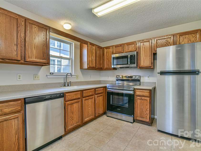 4101 Marble Way, Asheville, NC 28806.  MLS# CAR4392471, YatesRealty ID 51758. Making dinner already
