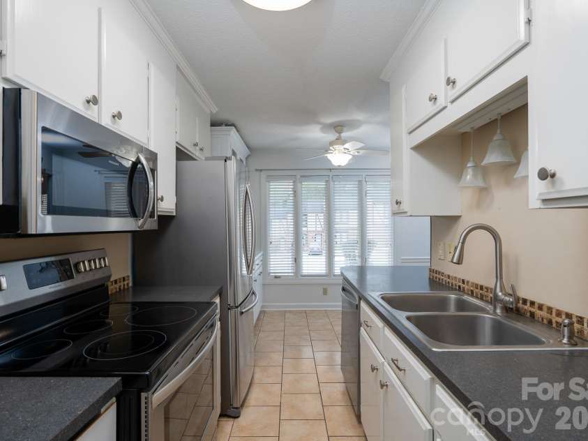 460 Camrose Circle, Concord, NC 28025.  MLS# CAR4426248, YatesRealty ID 51784. Galley Kitchen looking out front window & breakfast nook