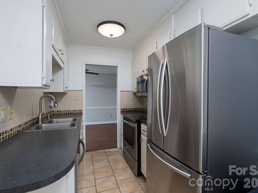 460 Camrose Circle, Concord, NC 28025.  MLS# CAR4426248, YatesRealty ID 51784. Kitchen view looking into Dining Room