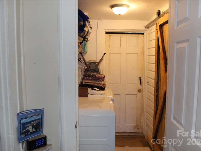 146 Summey Street, Forest City, NC 28043.  MLS# CAR4317368, YatesRealty ID 518. Hallway with laundry
