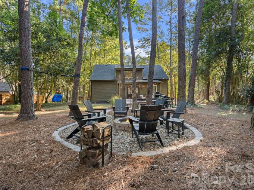 8331 Trail View Drive, Charlotte, NC 28226.  MLS# CAR4418749, YatesRealty ID 51810. Firepit in the backyard