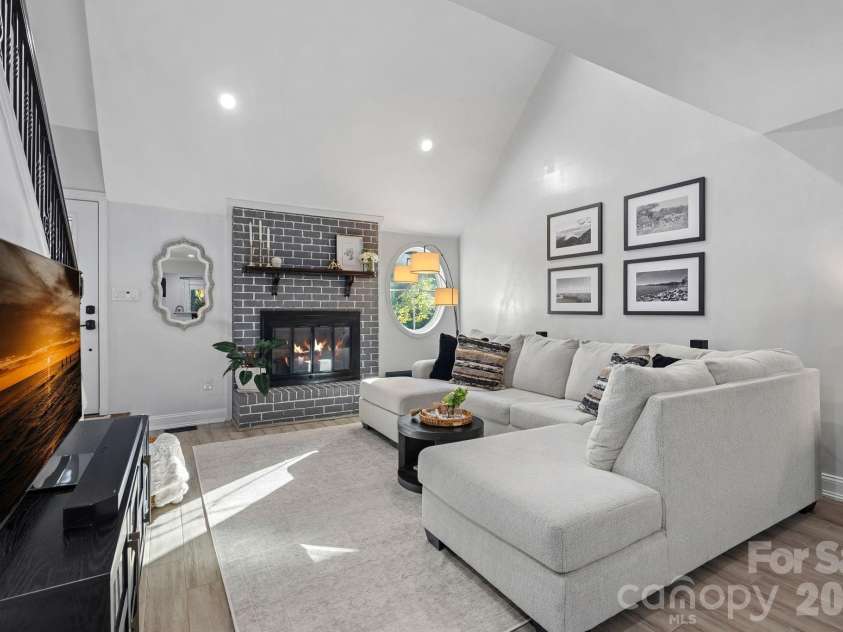 8331 Trail View Drive, Charlotte, NC 28226.  MLS# CAR4418749, YatesRealty ID 51810. Living room looking towards fireplace