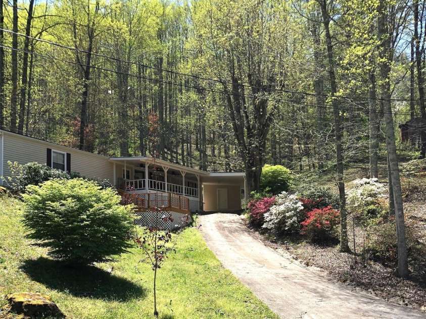 84 Greentree Lane, Canton, NC 28716.  MLS# CAR4239950, YatesRealty ID 5184. Beautiful front yard in the spring