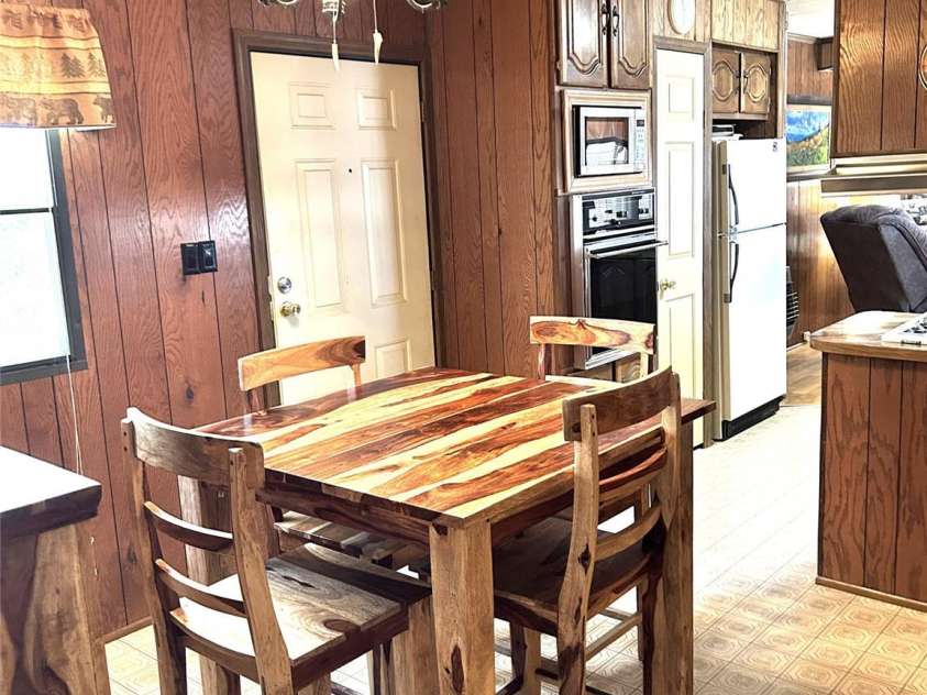 84 Greentree Lane, Canton, NC 28716.  MLS# CAR4239950, YatesRealty ID 5184. Lovely wood dining area