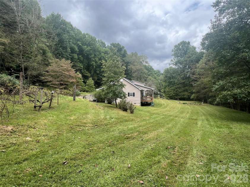 201 Face Lane, Burnsville, NC 28714.  MLS# CAR4426092, YatesRealty ID 51895. Large yard