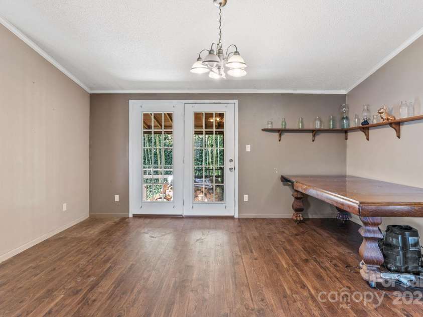 34 Berea Court, Waynesville, NC 28786.  MLS# CAR4234262, YatesRealty ID 5190. Dining area and back door to the covered porch.