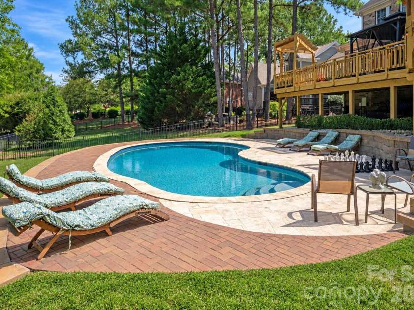 8506 Quellin Drive, Waxhaw, NC 28173.  MLS# CAR4425015, YatesRealty ID 51949. Custom Salt Water Pool