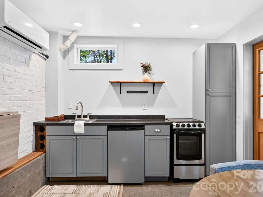 16 West Street, Asheville, NC 28801.  MLS# CAR4423666, YatesRealty ID 51960. Lower Level Mini-split
