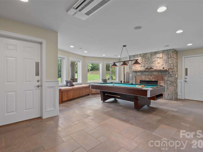 174 Marina Cove, Waynesville, NC 28785.  MLS# CAR4425258, YatesRealty ID 51963. An impressive lower-level gathering space with room for billiards, entertaining and more.