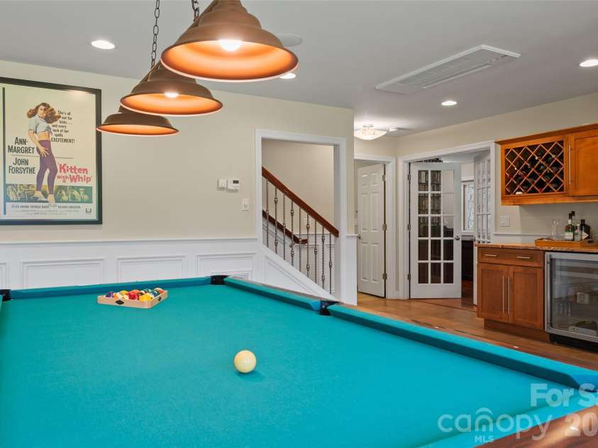 174 Marina Cove, Waynesville, NC 28785.  MLS# CAR4425258, YatesRealty ID 51963. Custom bar makes the lower-level recreation area ready for entertaining.