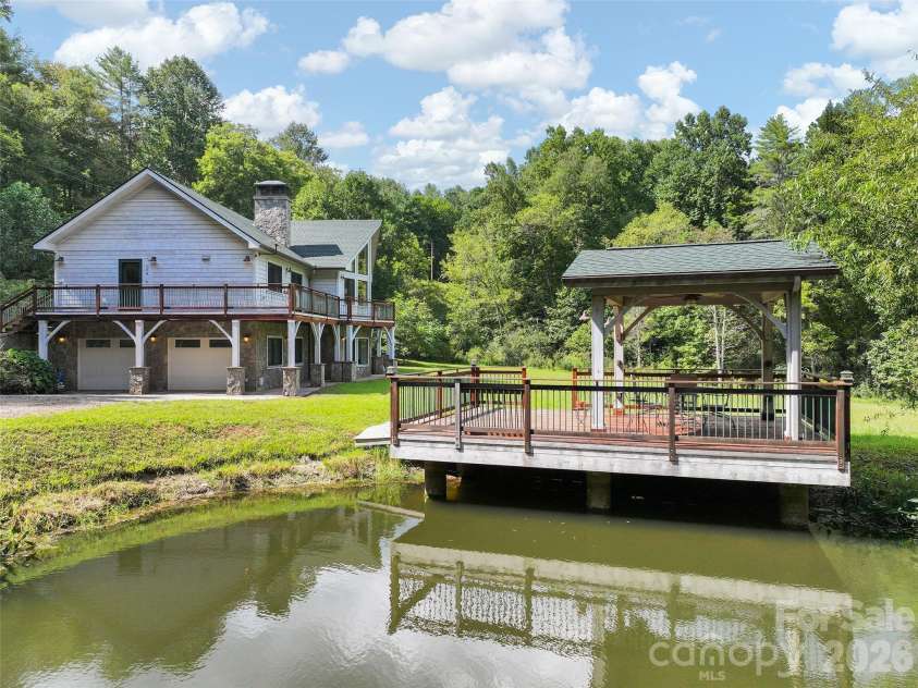 174 Marina Cove, Waynesville, NC 28785.  MLS# CAR4425258, YatesRealty ID 51963. Private pond with covered dock featuring durable ironwood decking and railing.
