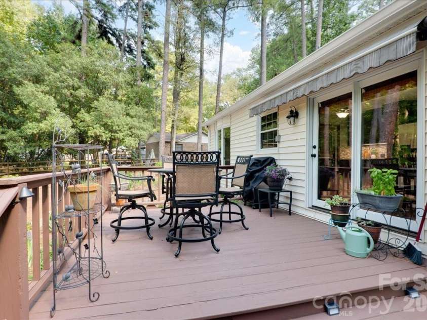 95 Scalybark Trail, Concord, NC 28027.  MLS# CAR4422844, YatesRealty ID 51966. Enjoy evenings on this private deck - with retractable awnings.