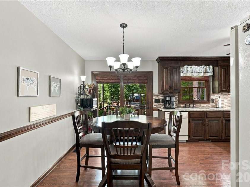 95 Scalybark Trail, Concord, NC 28027.  MLS# CAR4422844, YatesRealty ID 51966. Kitchen flows onto deck area