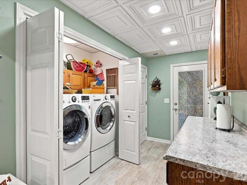 95 Scalybark Trail, Concord, NC 28027.  MLS# CAR4422844, YatesRealty ID 51966. Large laundry with entry to garage