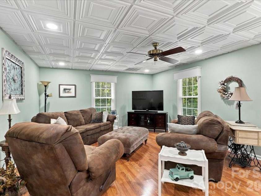 95 Scalybark Trail, Concord, NC 28027.  MLS# CAR4422844, YatesRealty ID 51966. Lower level family room with beautiful ceiling