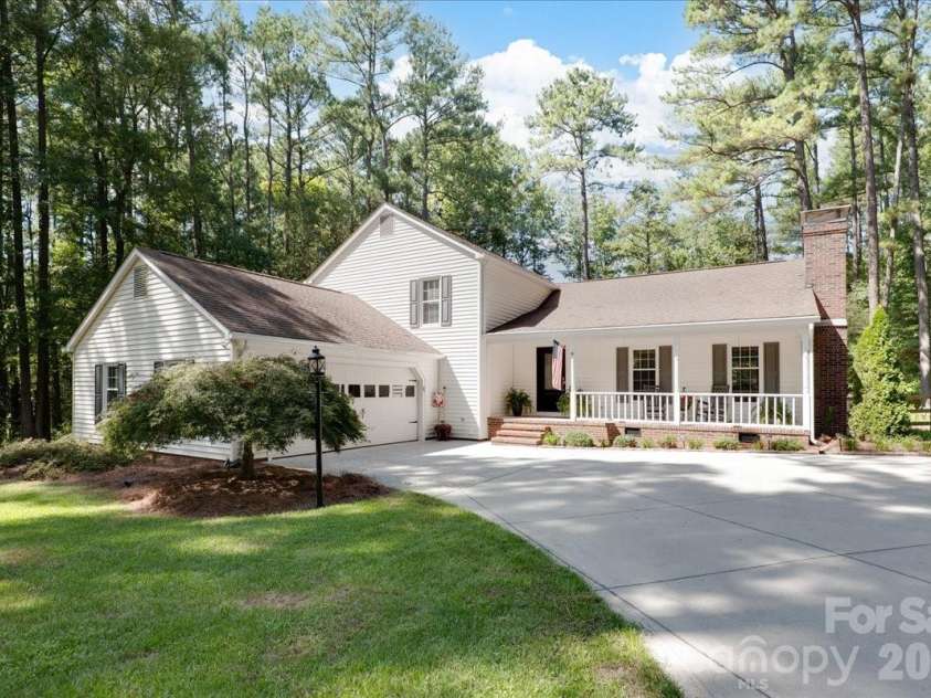 95 Scalybark Trail, Concord, NC 28027.  MLS# CAR4422844, YatesRealty ID 51966. Nestled in the trees - just over an acre