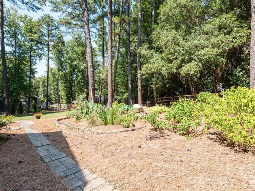 95 Scalybark Trail, Concord, NC 28027.  MLS# CAR4422844, YatesRealty ID 51966. Paver walkway - throughout the landscaping