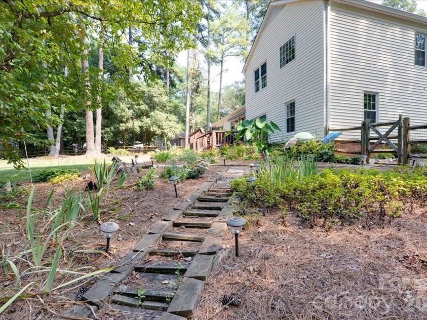 95 Scalybark Trail, Concord, NC 28027.  MLS# CAR4422844, YatesRealty ID 51966. Paver walkways throughout