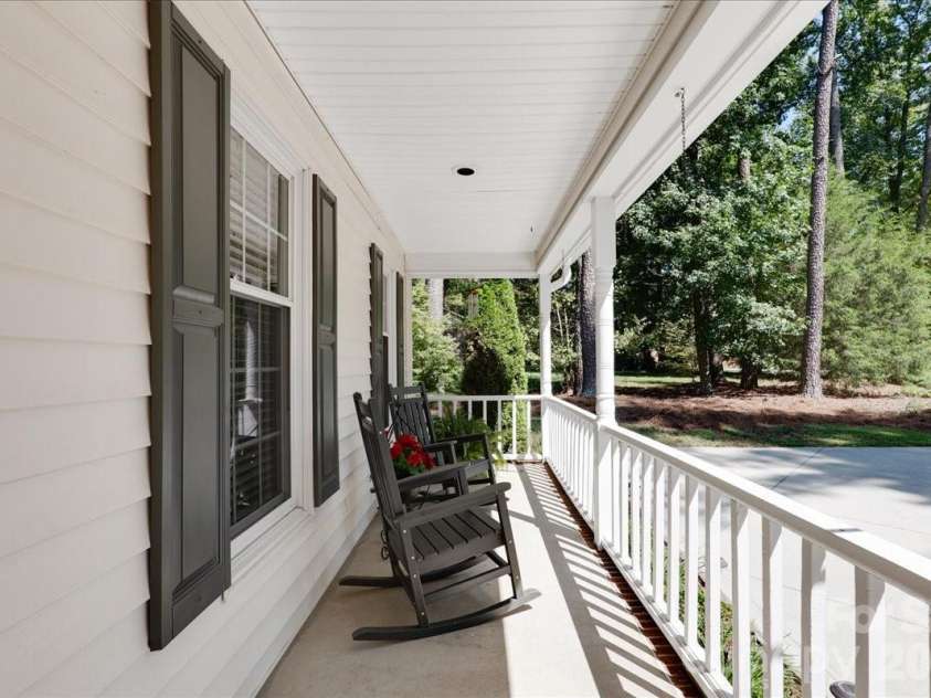 95 Scalybark Trail, Concord, NC 28027.  MLS# CAR4422844, YatesRealty ID 51966. Rocking chair front porch recently replaced with vinyl