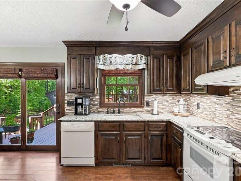 95 Scalybark Trail, Concord, NC 28027.  MLS# CAR4422844, YatesRealty ID 51966. What a view for your morning coffee - from inside or on the deck!