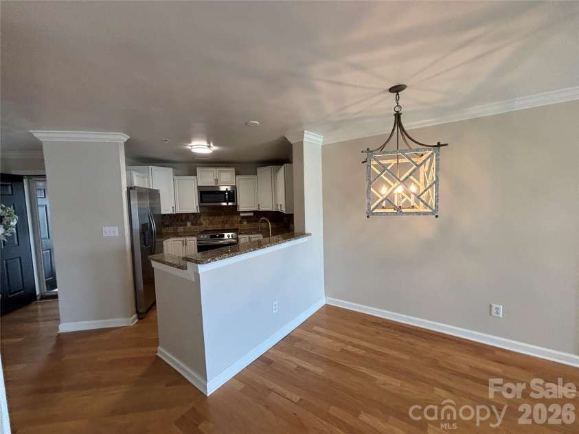 1332 Torrence Circle, Davidson, NC 28036.  MLS# CAR4422465, YatesRealty ID 51983. Dining area and kitchen counter.