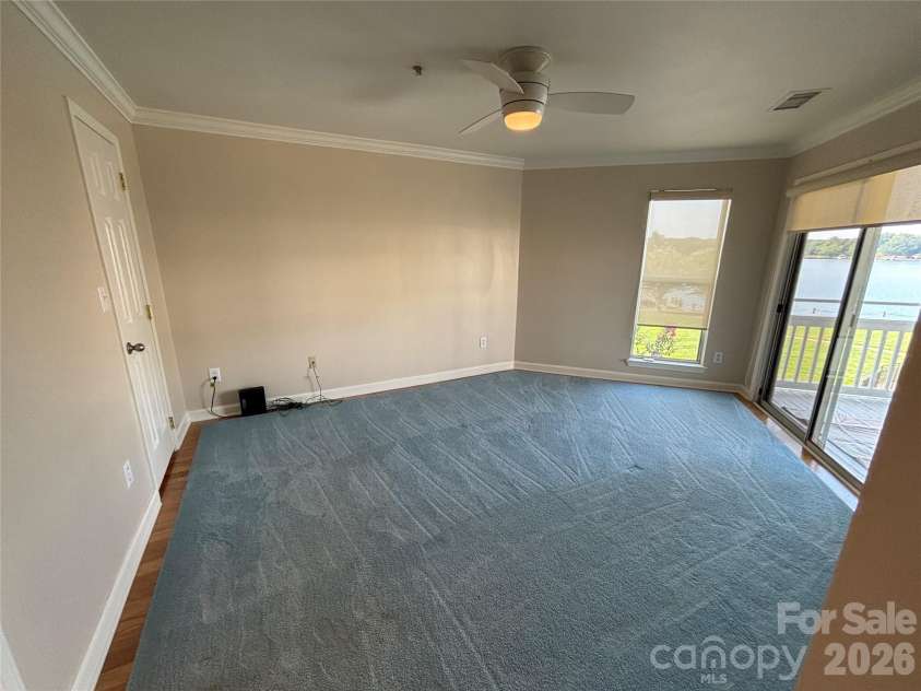 1332 Torrence Circle, Davidson, NC 28036.  MLS# CAR4422465, YatesRealty ID 51983. Primary bedroom views of the lake from here.