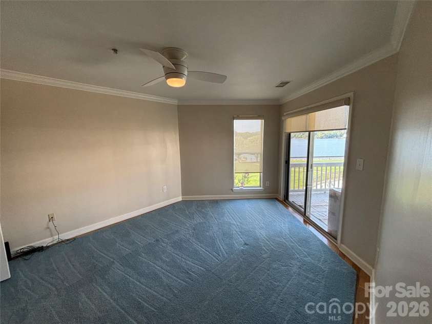 1332 Torrence Circle, Davidson, NC 28036.  MLS# CAR4422465, YatesRealty ID 51983. Primary bedroom views of the lake from here.
