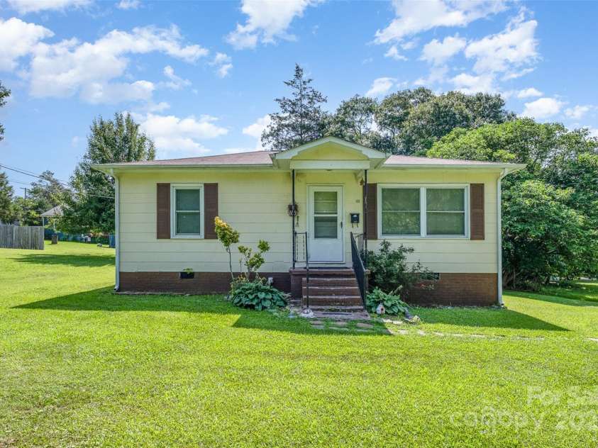 422 Wilson Street, Mount Holly, NC 28120.  MLS# CAR4272159, YatesRealty ID 520. Front of 410 Wilson