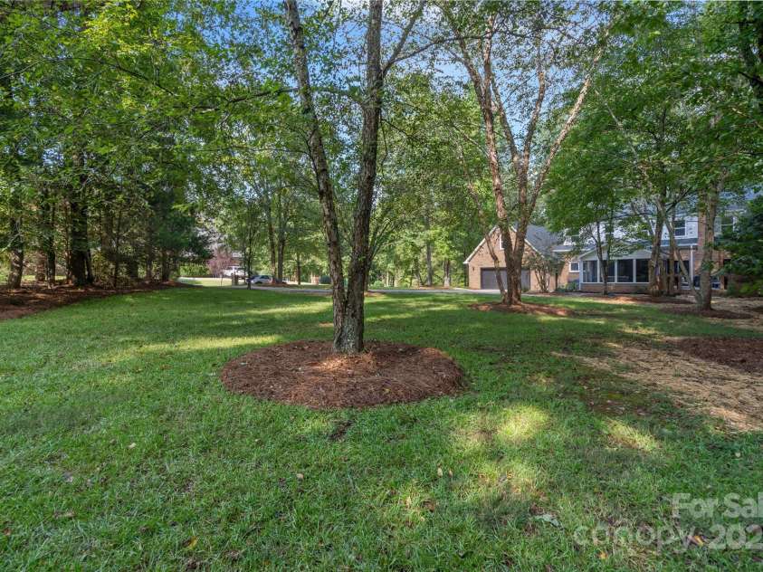 8503 Foxbridge Drive, Matthews, NC 28104.  MLS# CAR4179020, YatesRealty ID 5201. Beautiful and spacious yard.