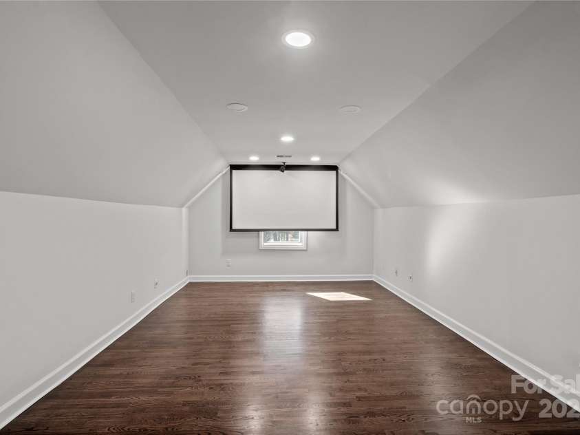 8503 Foxbridge Drive, Matthews, NC 28104.  MLS# CAR4179020, YatesRealty ID 5201. Drop down projector screen in the media loft.