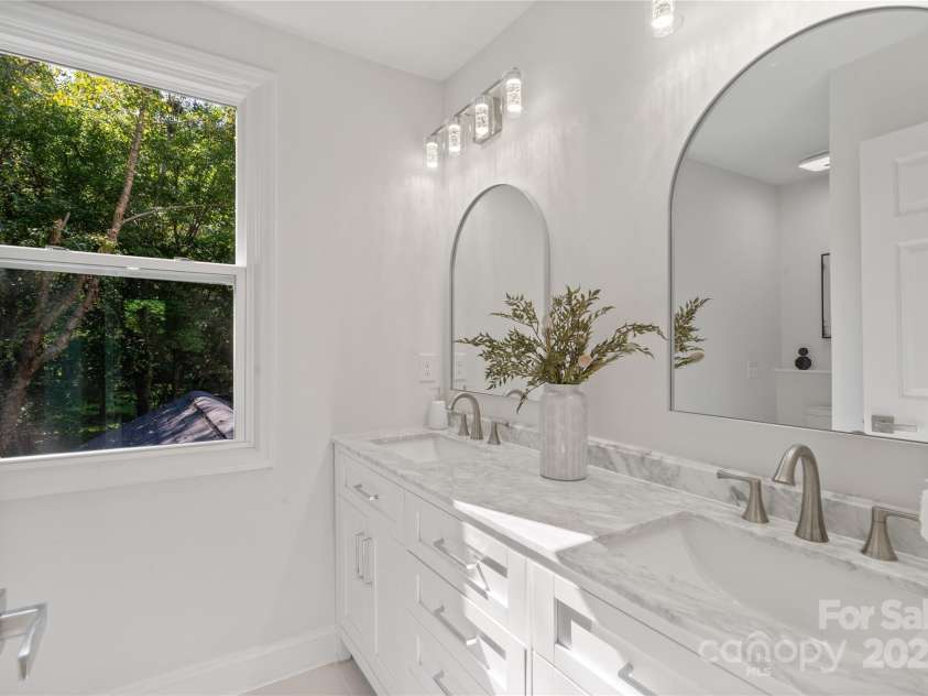 8503 Foxbridge Drive, Matthews, NC 28104.  MLS# CAR4179020, YatesRealty ID 5201. Hall bathroom on the second floor.