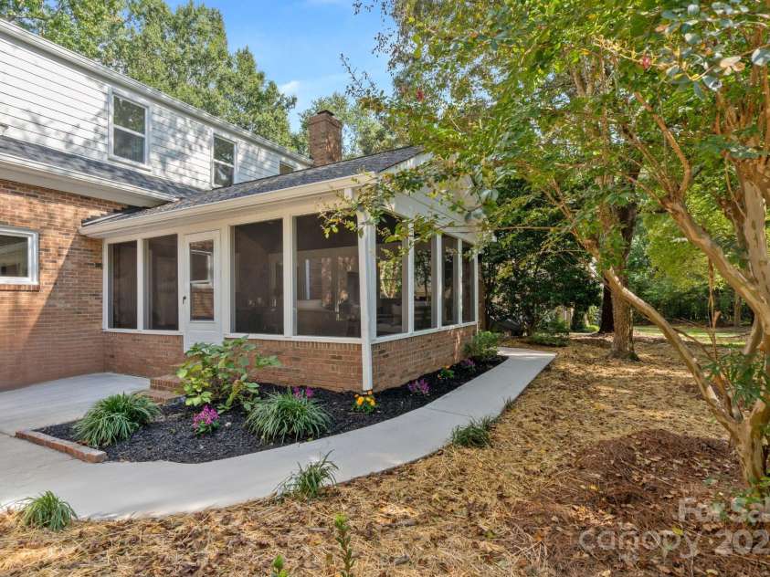 8503 Foxbridge Drive, Matthews, NC 28104.  MLS# CAR4179020, YatesRealty ID 5201. Large screened-in porch.