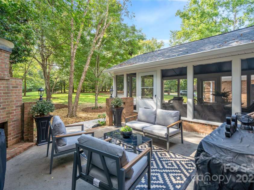 8503 Foxbridge Drive, Matthews, NC 28104.  MLS# CAR4179020, YatesRealty ID 5201. New gas grill, prep cart, and patio furniture included.
