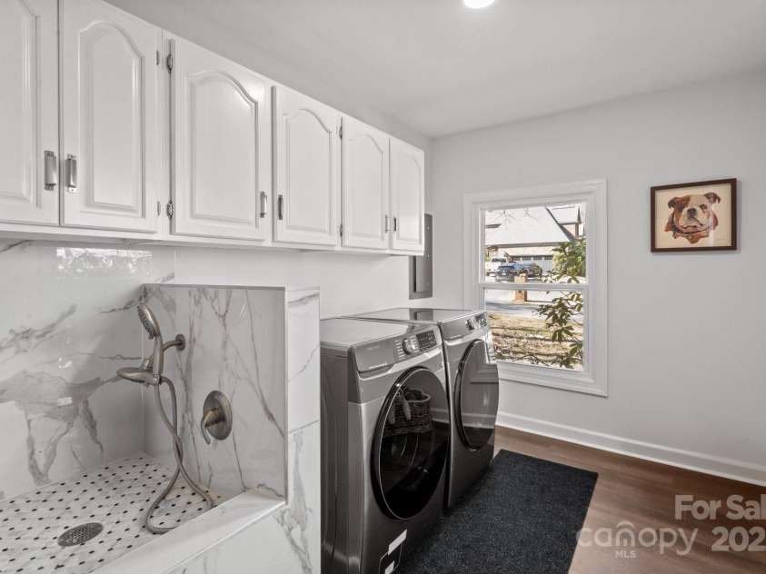 8503 Foxbridge Drive, Matthews, NC 28104.  MLS# CAR4179020, YatesRealty ID 5201. New washer and dryer and awesome doggy bath station.