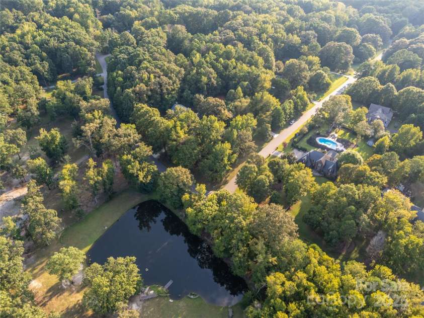 8503 Foxbridge Drive, Matthews, NC 28104.  MLS# CAR4179020, YatesRealty ID 5201. Pond located across the street providing spectacular views from every front facing window