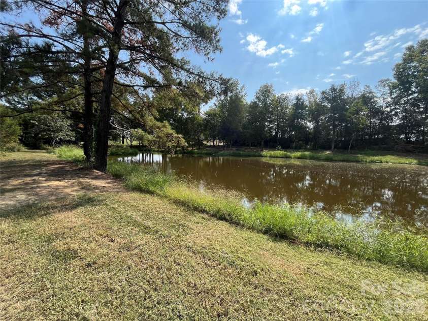 5810 Wolf Pond Road, Monroe, NC 28112.  MLS# CAR4426485, YatesRealty ID 52012. Pond view