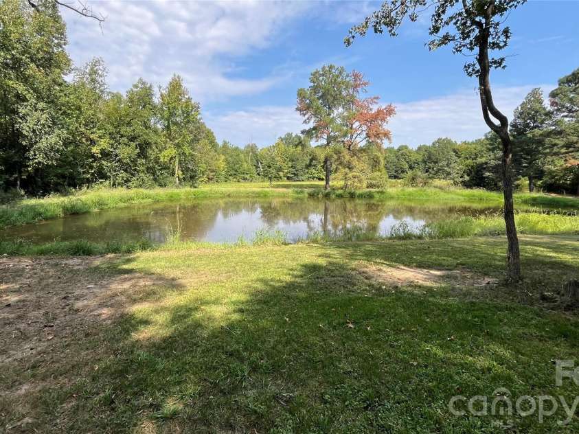 5810 Wolf Pond Road, Monroe, NC 28112.  MLS# CAR4426485, YatesRealty ID 52012. Pond view