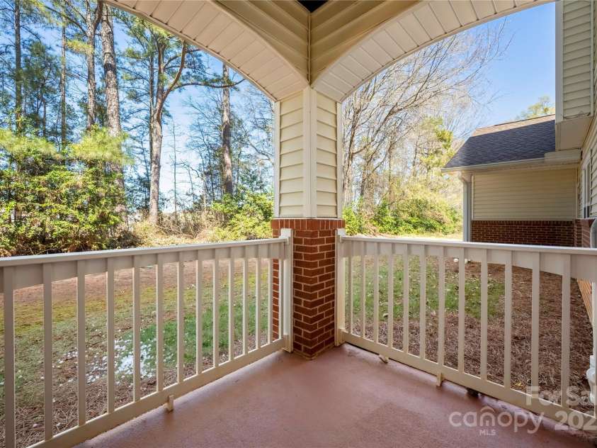 16312 Redstone Mountain Lane, Charlotte, NC 28277.  MLS# CAR4237110, YatesRealty ID 5202. Back porch with wooded view