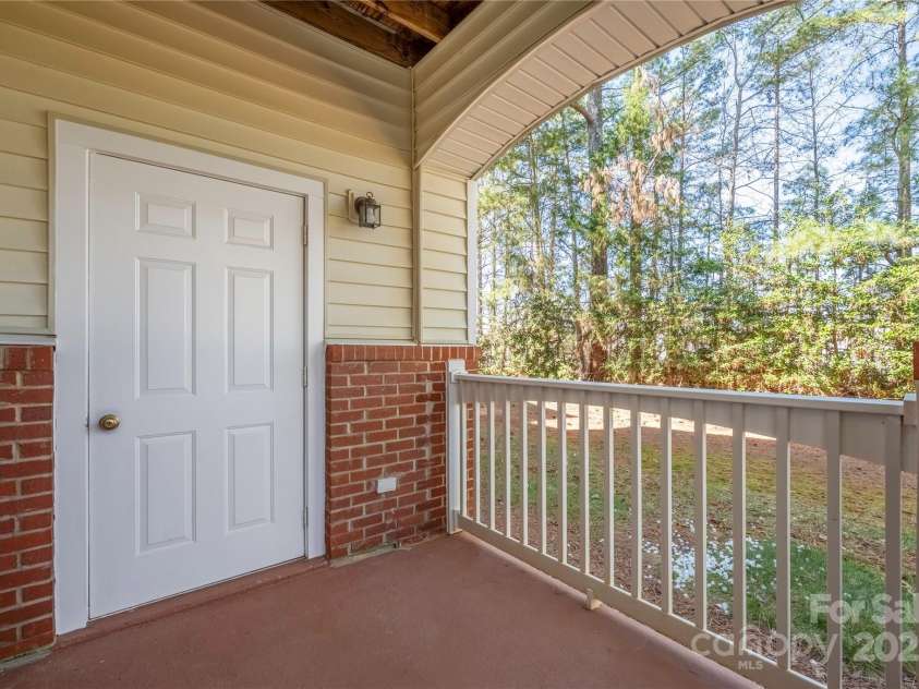 16312 Redstone Mountain Lane, Charlotte, NC 28277.  MLS# CAR4237110, YatesRealty ID 5202. Covered back porch with storage closet