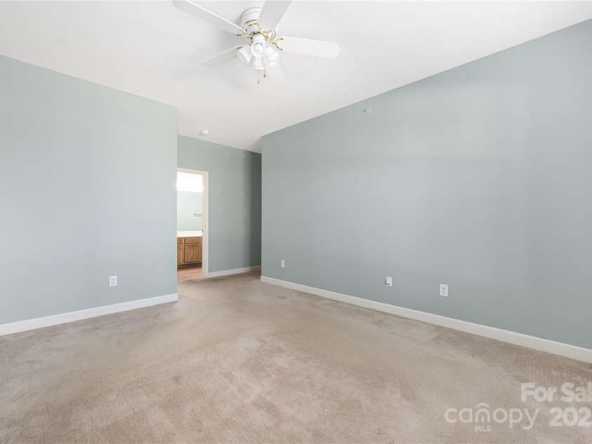 16312 Redstone Mountain Lane, Charlotte, NC 28277.  MLS# CAR4237110, YatesRealty ID 5202. Primary bedroom with view towards ensuite bath