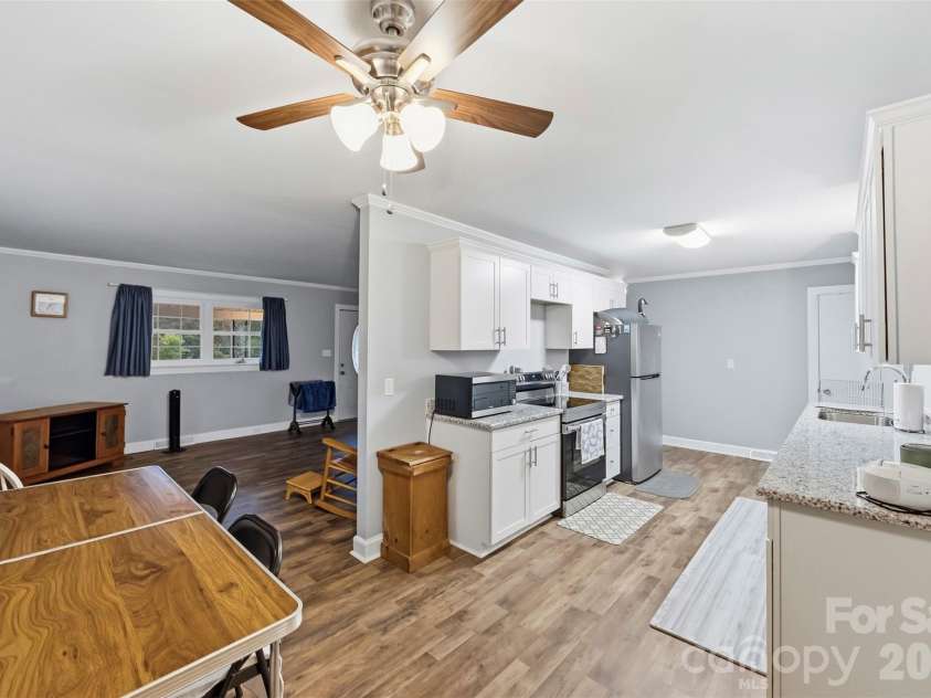 1094 Union Street, Concord, NC 28025.  MLS# CAR4426577, YatesRealty ID 52033. Living Room & Kitchen