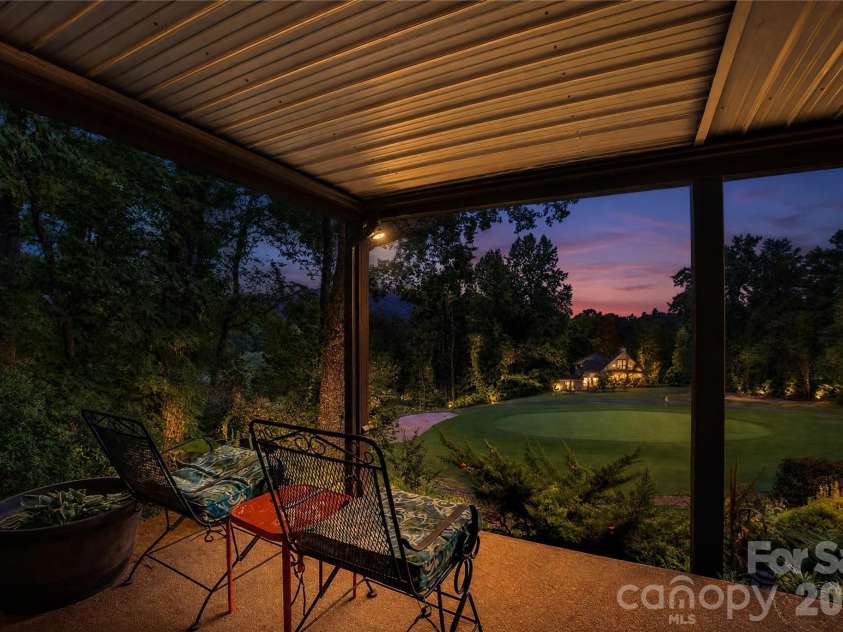 196 Fern Loop, Lake Lure, NC 28746.  MLS# CAR4425558, YatesRealty ID 52036. Golf course view at twilight from lower level